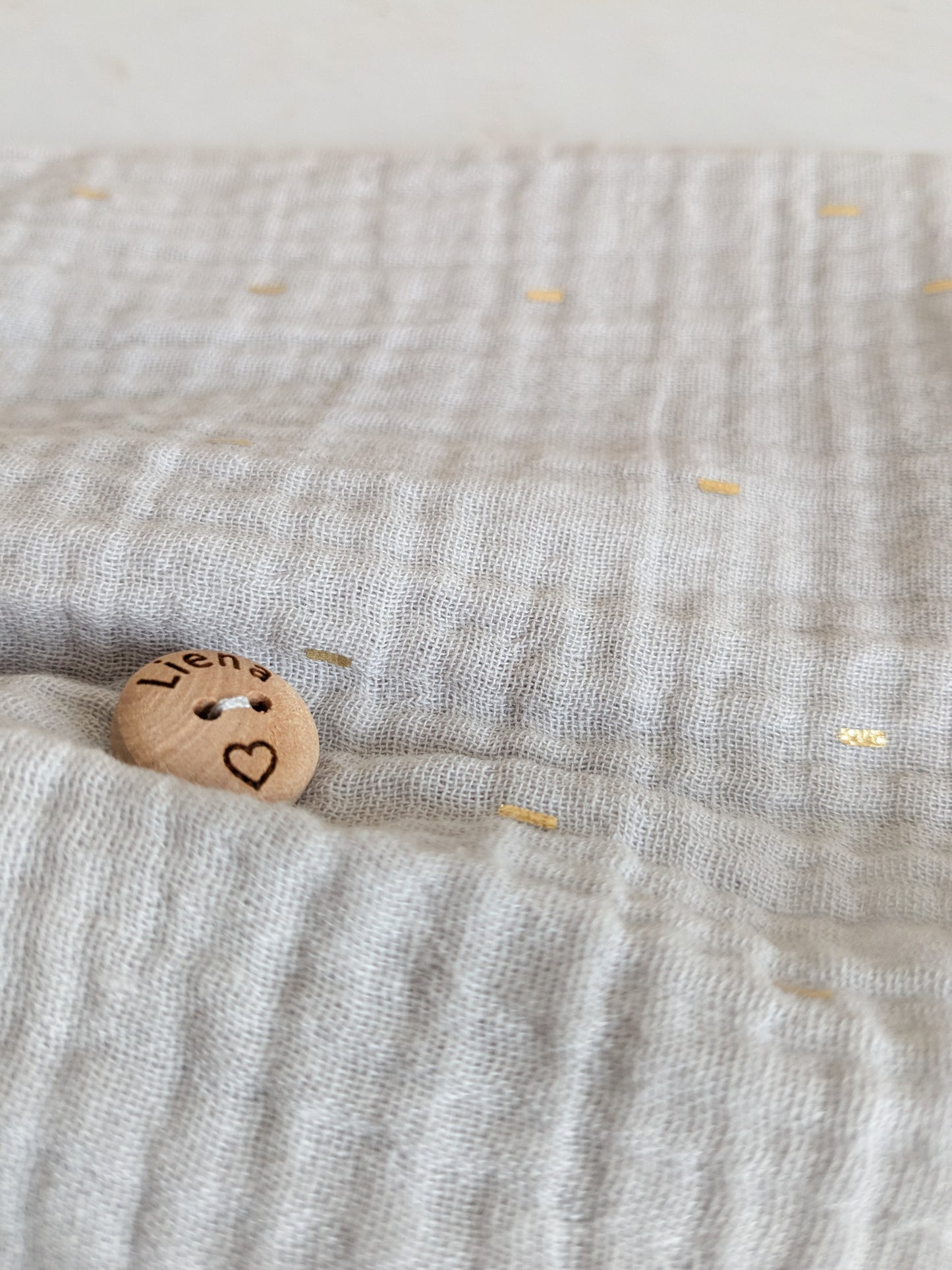 Grijs kleedje met gouden detail